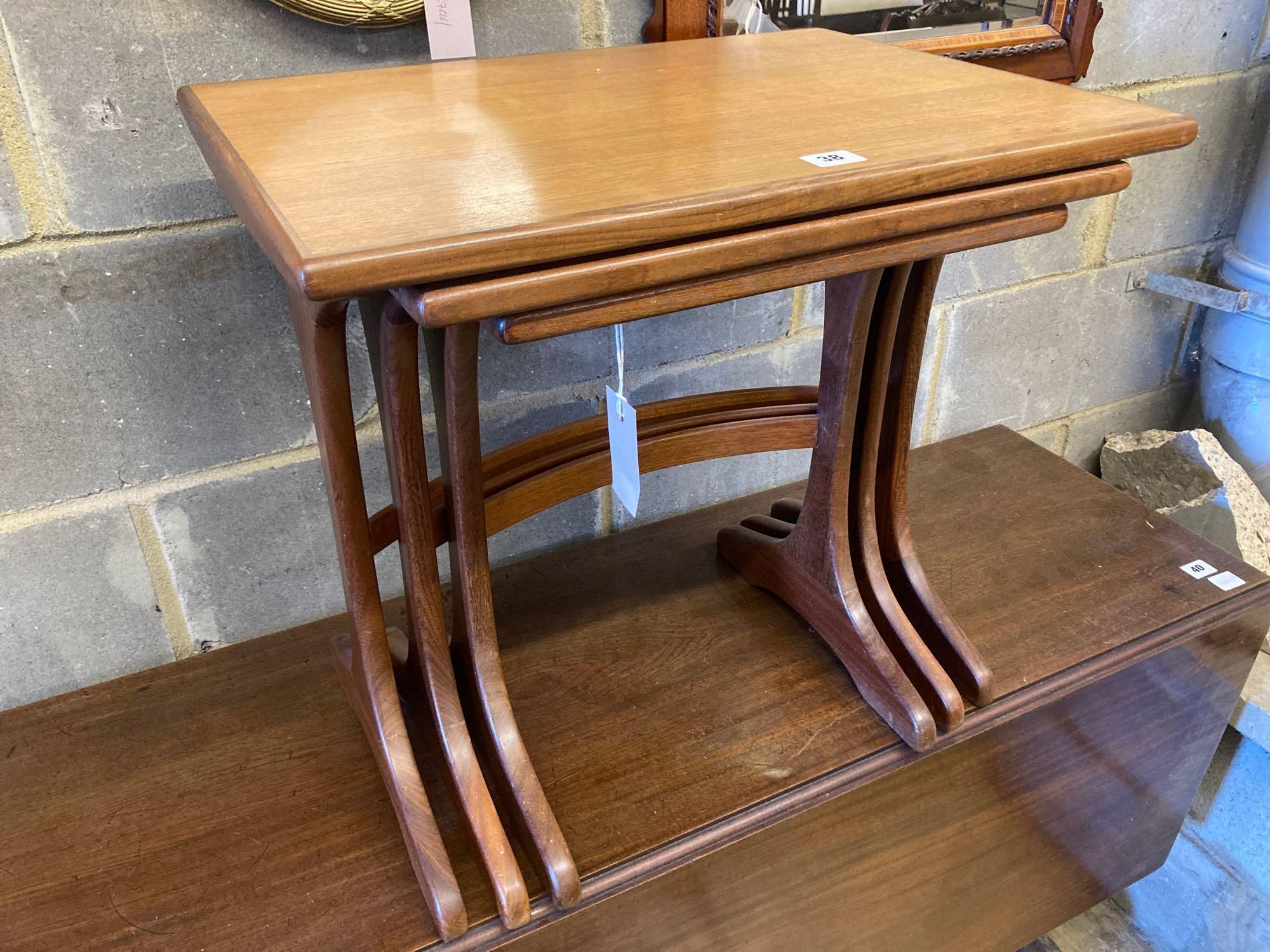 A nest of three G plan teak occasional tables, width 56cm